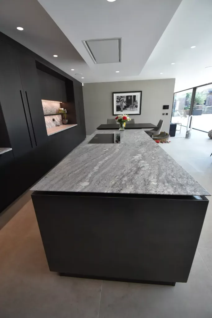 black kitchen with island grey worktop